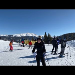 Black belted ski suit